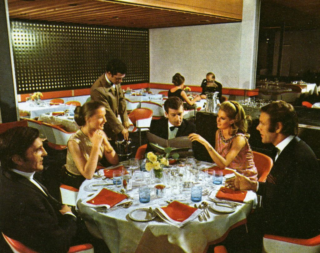 Guests dining in the Britannia restaurant on board QE2 in the 1970s